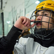 Youth Hockey Player Wearing Shock Doctor Protective Hockey Wrist Guard