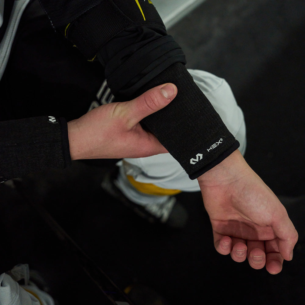 Youth Hockey Player Wearing Shock Doctor Protective Hockey Wrist Guard - Back of Wrist Guard