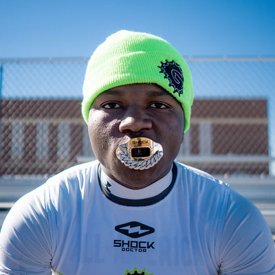 7v7 Football Athlete Wearing Shock Doctor 3D Gold Ice Chain Max AirFlow Football Mouthguard