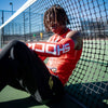 Lifestyle Image of Youth 7v7 Football Athlete Wearing Shock Doctor Red Compression Sleeves - Detail View