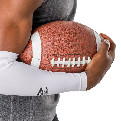 Shock Doctor Showtime Grip Sleeve - White - On Model - Wearing Sleeve While Holding Football