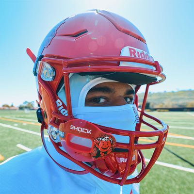 Youth Tackle Football Player Wearing Shock Doctor Kool Aid Max AirFlow Football Mouthguard (Cherry Flavor)