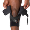 Shock Doctor Hyperlite Knee Brace with Heavy Duty Hinges - On-Body - Athlete using Adjustable Closure for Easy On and Off