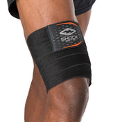 HyperWrap Multi-Use Compression Wrap by Shock Doctor shown in black, providing adjustable support for wrist and knee with wrap-around design.