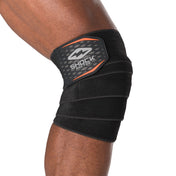 HyperWrap Multi-Use Compression Wrap by Shock Doctor shown in black (side view), providing adjustable support for knee with wrap-around design.