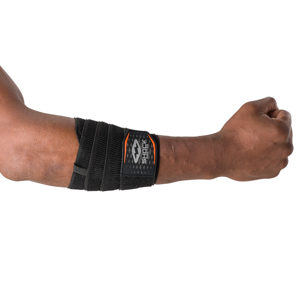 HyperWrap Multi-Use Compression Wrap by Shock Doctor shown in black, providing adjustable support for forearm with wrap-around design.