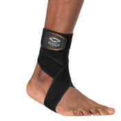 HyperWrap Multi-Use Compression Wrap by Shock Doctor shown in black, providing adjustable support for ankle with wrap-around design.