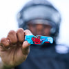 Youth Tackle Football Player Showcasing Shock Doctor Kool Aid Gel Max Power Flavor Fusion Mouthguard