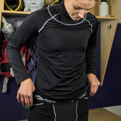 Lifestyle Shot of Female Hockey Player Wearing Shock Doctor Women's Compression Hockey Pant With Pelvic Protector - Detail View