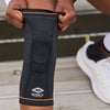 Detail View of Athlete Sliding on Shock Doctor Ultra Knit Knee Support with Full Patella Gel & Stays Before Workout