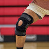 Athlete Wearing Shock Doctor Knee Brace with Dual Wrap & Heavy-Duty Hinges on Court