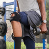 Detail View of Athlete Wearing Shock Doctor Dual Strap Knee Wrap While Lifting Weights